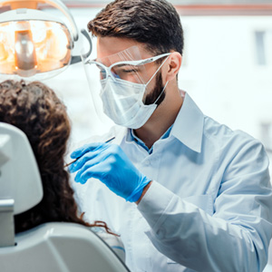 Patient in La Crosse talking to dentist about dental emergency