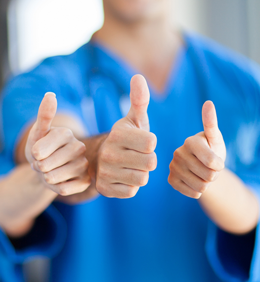 Three La Crosse dental team members giving thumbs up