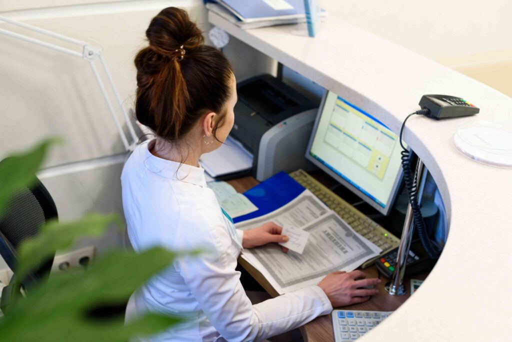 Receptionist working at a desk