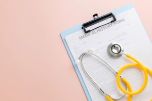 Medical history form attached to clipboard