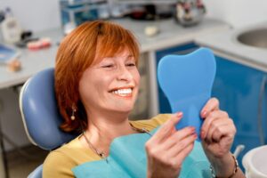 Woman smiling with dental implants