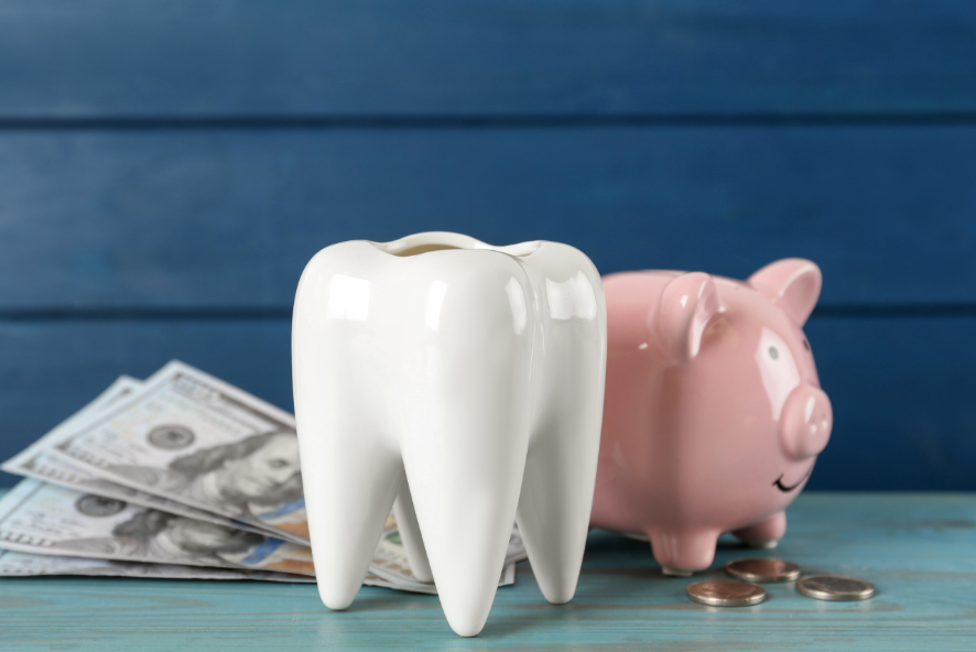 Porcelain tooth decoration with piggy bank, coins, and bills